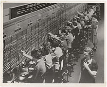 220px-Photograph_of_Women_Working_at_a_Bell_System_Telephone_Switchboard_(3660047829).jpg
