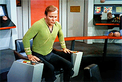 capitain-kirk-sitting-in-chair-on-tribble.gif
